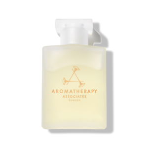 frosted glass bottle of aromatherapy associates destress bath oil