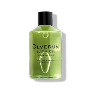 bright green olverum bath oil in bottle with black font and writing