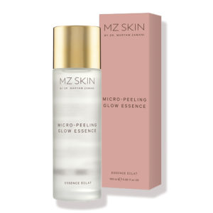 MZ Skin Glow Essence clear bottle with gold top next to its pink box packaging