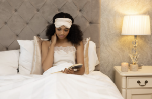 woman in bed with silk eye mask on